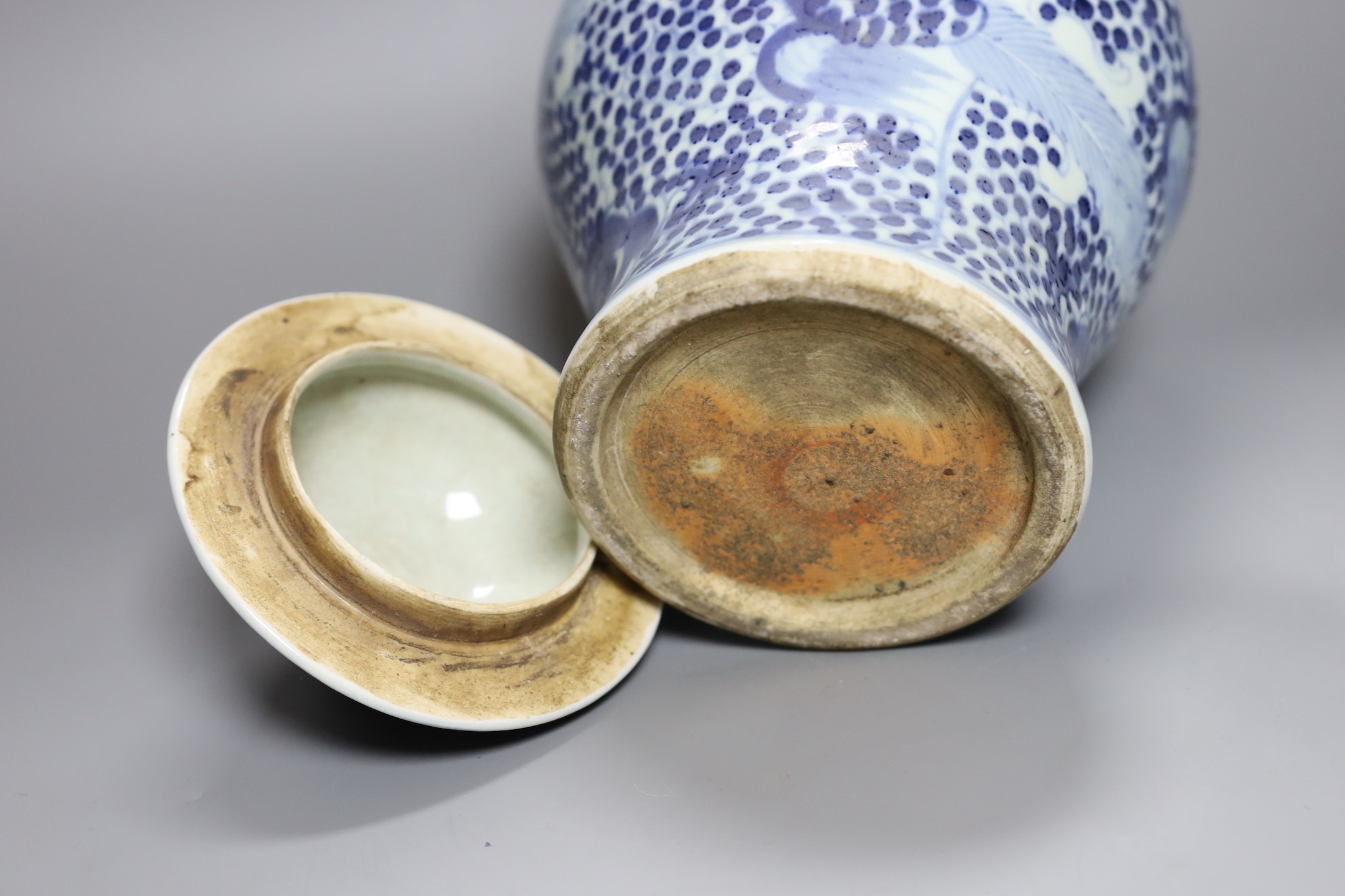 A 19th century Chinese blue and white lidded baluster vase, 28cm tall